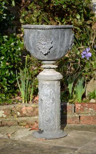 A FRENCH LEAD GARDEN URN ON PEDESTA