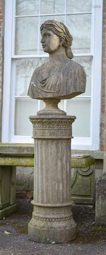 A CARVED STONE BUST OF A YOUNG WOMAN ON PEDESTAL BASE