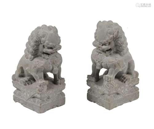 A PAIR OF CARVED STONE GARDEN ORNAMENTS