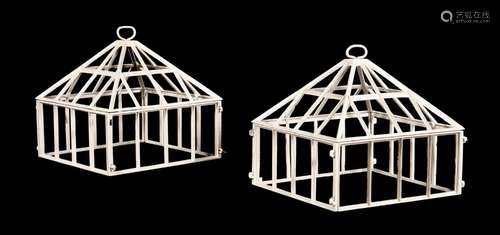 A PAIR OF WHITE PAINTED METAL CLOCHES IN VICTORIAN STYLE