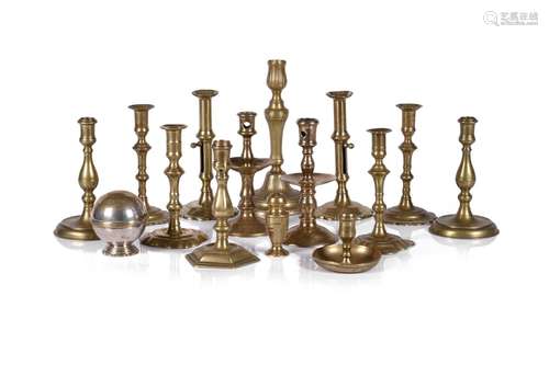 A GROUP OF TWELVE VARIOUS BRASS CANDLESTICKS