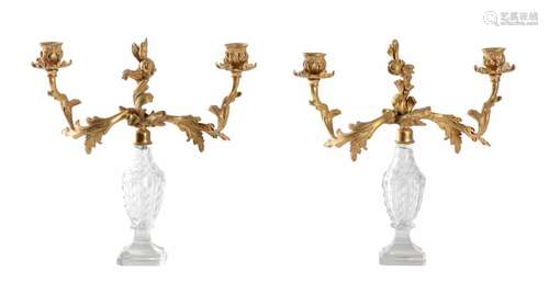 A PAIR OF CUT GLASS AND GILT METAL MOUNTED TWO ARM CANDELABR...