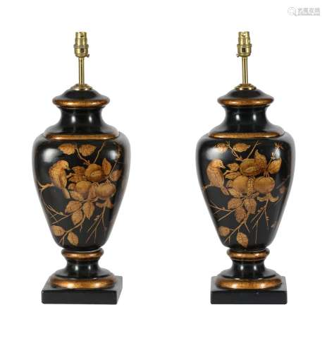 A PAIR OF BLACK AND GILT DECORATED POTTERY TABLE LAMPS IN RE...