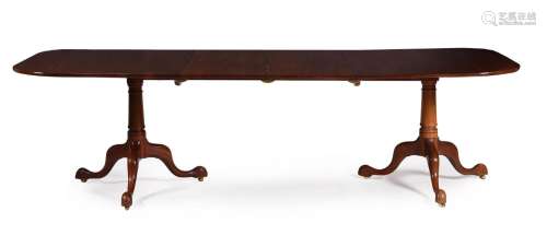 A MAHOGANY TWIN PILLAR DINING TABLE IN GEORGE III STYLE