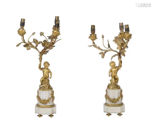 A PAIR OF FRENCH ORMOLU AND WHITE MARBLE THREE-LIGHT CANDELA...