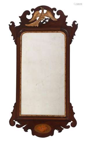 AN EDWARDIAN MAHOGANY AND INLAID FRET FRAME MIRROR IN GEORGE...