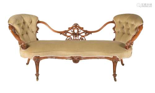 A VICTORIAN WALNUT AND UPHOLSTERED SOFA