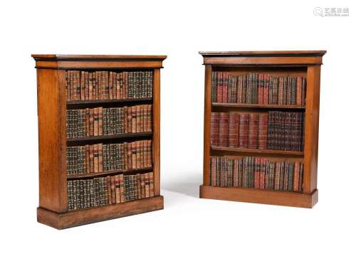 A MATCHED PAIR OF OAK AND EBONISED OPEN BOOKCASES
