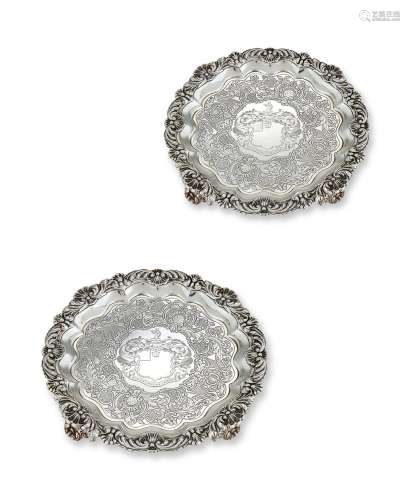 A PAIR OF GEORGE III SILVER SHAPED CIRCULAR SALVERS