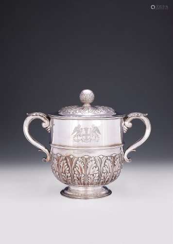 A SILVER TWIN HANDLED CUP AND COVER