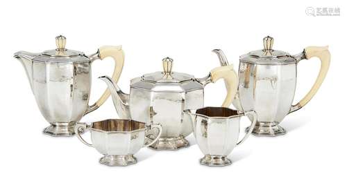 Y A CASED SILVER FIVE PIECE CIRCULAR FLUTED TEA AND COFFEE S...