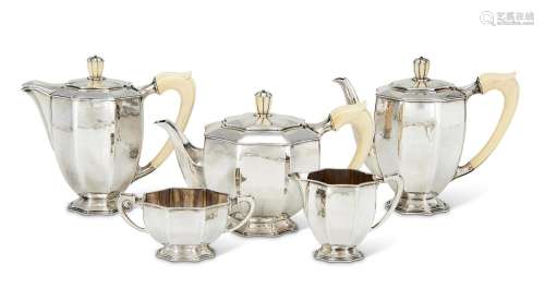 Y A CASED SILVER FIVE PIECE CIRCULAR FLUTED TEA AND COFFEE S...