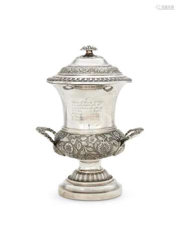 AN INDIAN COLONIAL TROPHY CUP AND COVER