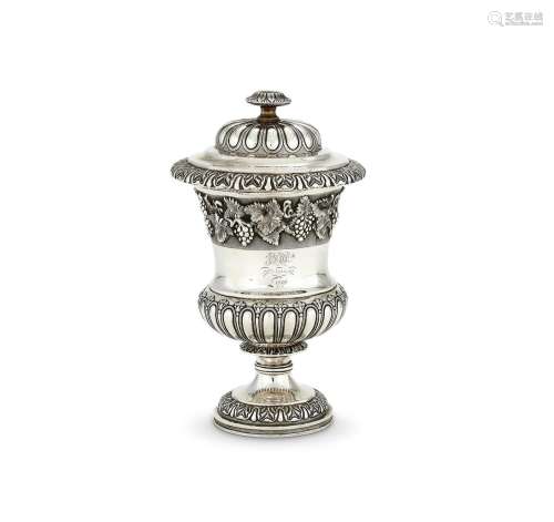 AN INDIAN COLONIAL SILVER CAMPANA SHAPED VASE AND COVER
