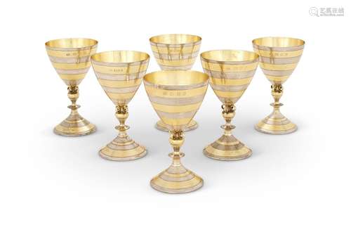 A SET OF SIX SILVER AND SILVER GILT GOBLETS