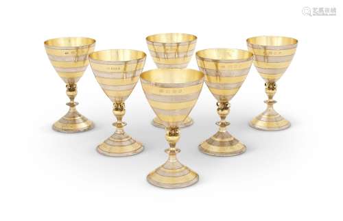 A SET OF SIX SILVER AND SILVER GILT GOBLETS