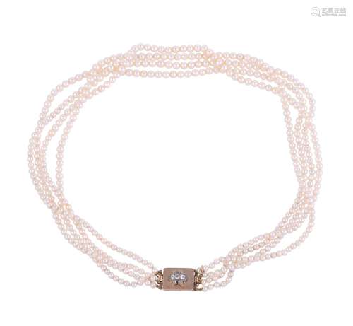 A GRADUATED FOUR STRAND PEARL NECKLACE TO A DIAMOND CLASP