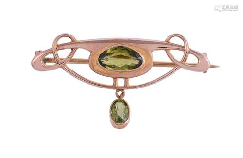 BARNET HENRY JOSEPH, A PERIDOT ARTS AND CRAFTS BROOCH, CIRCA...