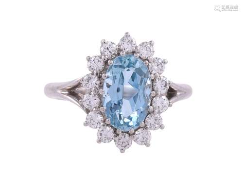 AN AQUAMARINE AND DIAMOND CLUSTER RING