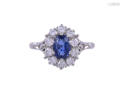 A SAPPHIRE AND DIAMOND CLUSTER RING, LONDON 1981