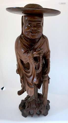 CHINE<br />
Figurine en bois sculpté représentant un bouddha...