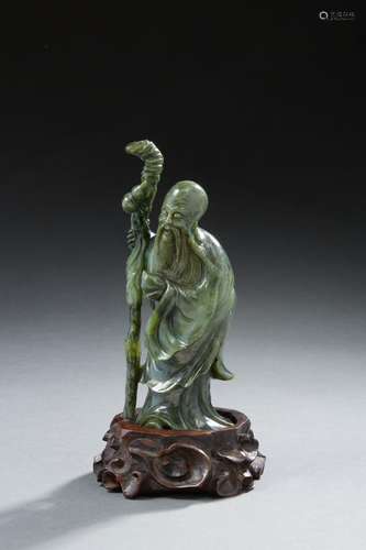 CHINE<br />
Figurine en pierre dure à l’imitation du jade re...