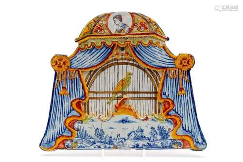 A large Delft polychrome pottery birdcage plaque