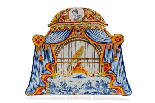 A large Delft polychrome pottery birdcage plaque