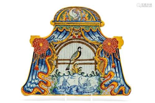 A large Delft polychrome pottery birdcage plaque