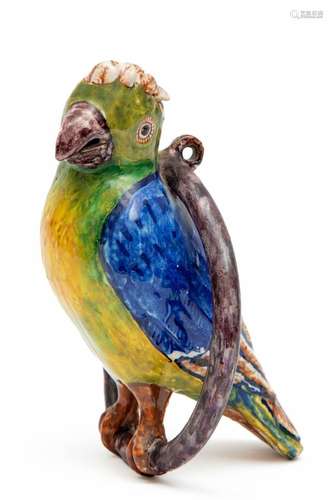 A Delft polychrome tin glazed pottery parrot on a ring