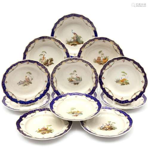 A set of twelve The Hague decorated Tournai porcelain plates