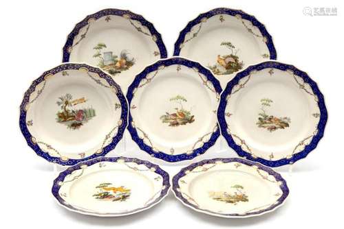 Seven The Hague decorated Tournai porcelain plates