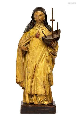 A carved and polychrome painted wooden figure of Saint Ursul...