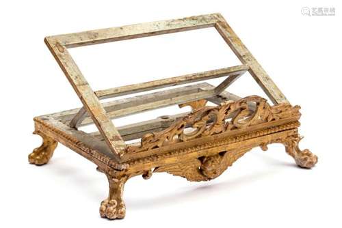 An Italian carved, painted and giltwood book stand