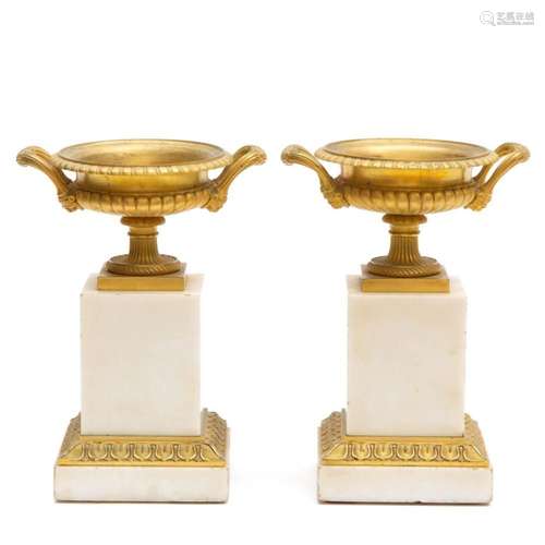 A pair of French Empire ormolu and white marble vases