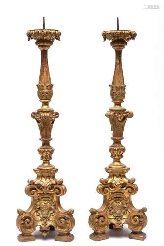 A pair of large Italian carved giltwood pricket candlesticks