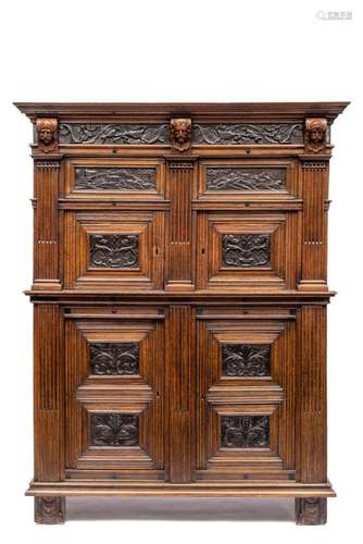 A Dutch oak and carved ebony cupboard  pilasterkast