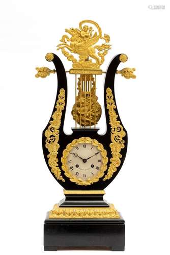 A French ormolu-mounted and ebonised lyre mantle clock