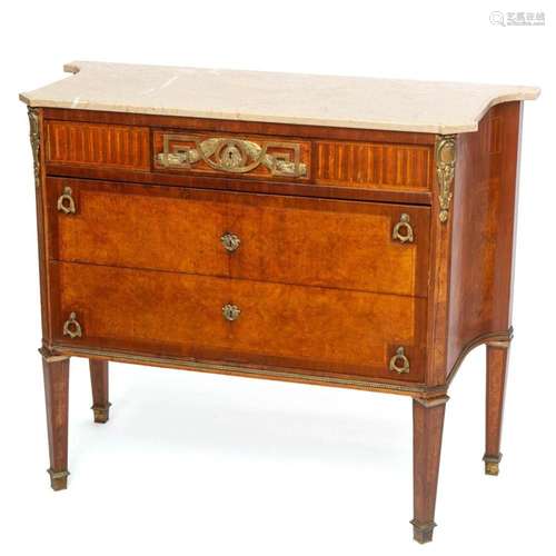 A French ormolu-mounted mahogany, amboyna, and satinwood com...