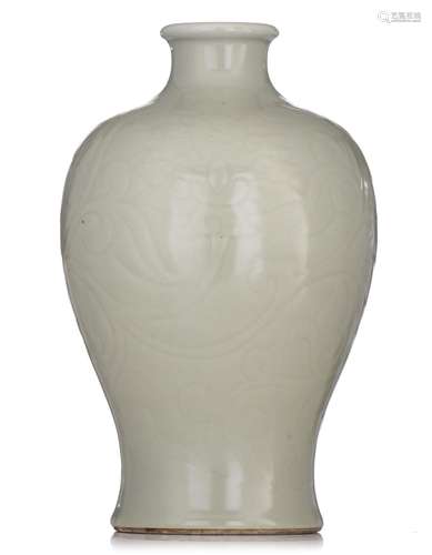 A Chinese carved celadon-glazed vase, late 19thC/20thC, H 31...