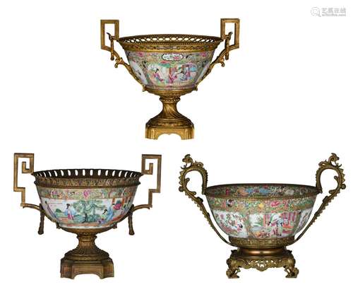 Three Chinese Canton famille rose punch bowls, all with gilt...