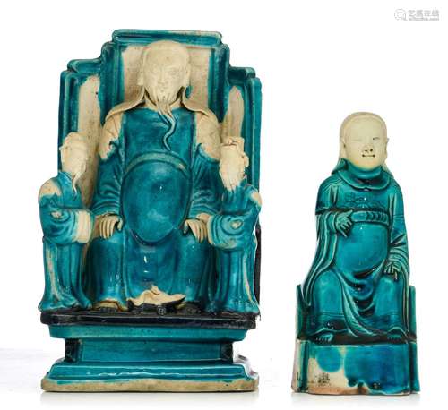 Two turquoise and aubergine glazed biscuit figures of Zhenwu...