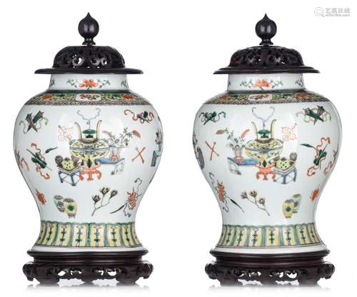 A pair of Chinese famille verte baluster vases and hardwood ...