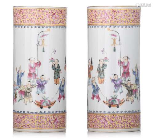 An extremely fine pair of Chinese famille rose cylindrical v...