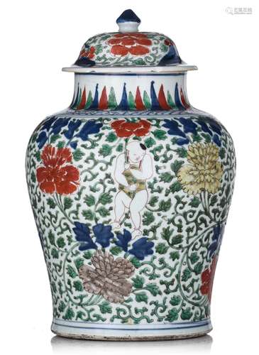 A Chinese wucai 'He He boy' vase and cover, Transitional per...