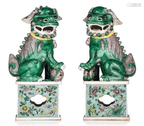 A pair of playful Chinese famille verte figures of Buddhist ...