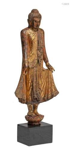 A Burmese gilded wooden figure of the standing Buddha, 19thC...