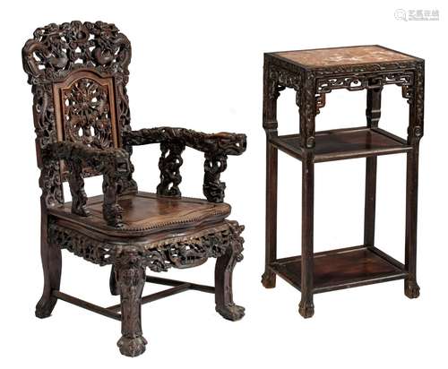 A Chinese carved hardwood throne and a carved base with a ma...