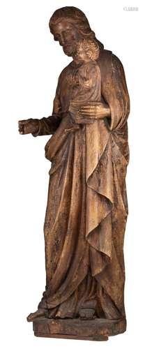 A Gothic Revival oak sculpture of Saint Joseph with the Holy...