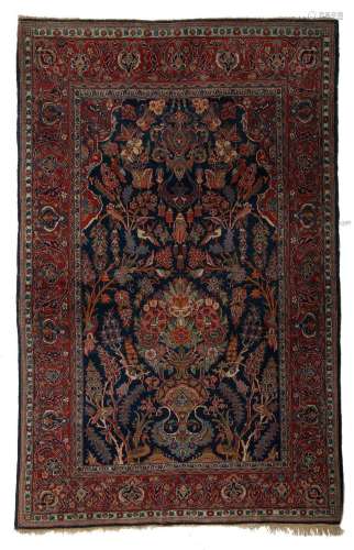 An Oriental Kashan carpet, decorated with birds on flower br...